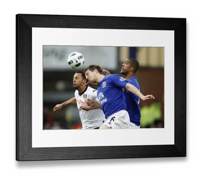 Framed Print : Battle at Goodison Park: Distin, Jagielka vs Dembele - Everton's Defensive Triumph (Everton v Fulham, Barclays Premier League, 19 March 2011)