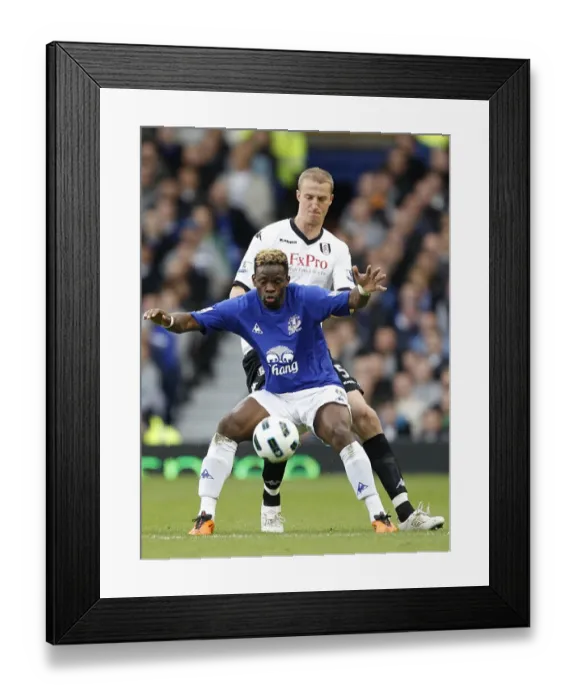 Framed Print : Battle for the Ball: Saha vs. Hangeland - Everton vs. Fulham, Premier League (2011)
