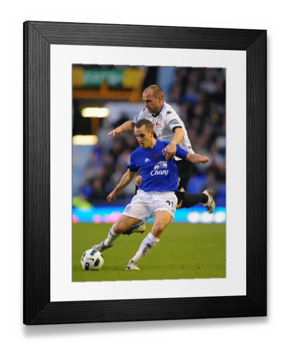 Framed Print : Intense Battle: Osman vs Murphy at Goodison Park - Everton vs Fulham, Barclays Premier League (19 March 2011)