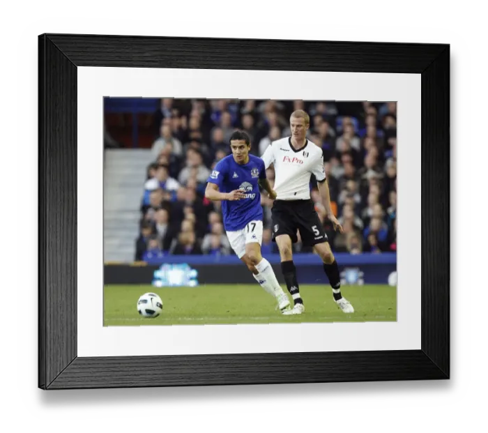 Framed Print : Intense Battle: Tim Cahill vs. Brede Hangeland at Goodison Park - Everton vs. Fulham, Barclays Premier League (19 March 2011) Framed Print : Intense Battle: Tim Cahill vs. Brede Hangeland at Goodison Park - Everton vs. Fulham, Barclays Premier League (19 March 2011)
