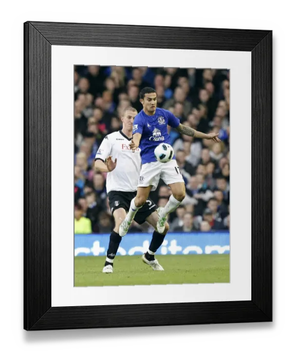 Framed Print : Tim Cahill Shields Ball from Hangeland: Everton's Defensive Masterclass vs. Fulham (19 March 2011, Goodison Park) Framed Print : Tim Cahill Shields Ball from Hangeland: Everton's Defensive Masterclass vs. Fulham (19 March 2011, Goodison Park)