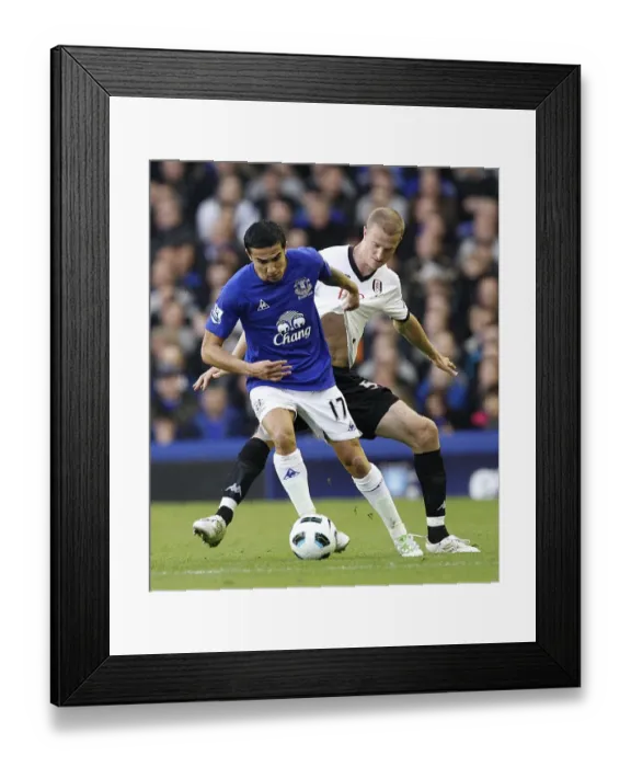 Framed Print : Tim Cahill Shields Ball from Brede Hangeland: Everton vs Fulham, Barclays Premier League (19 March 2011) Framed Print : Tim Cahill Shields Ball from Brede Hangeland: Everton vs Fulham, Barclays Premier League (19 March 2011)