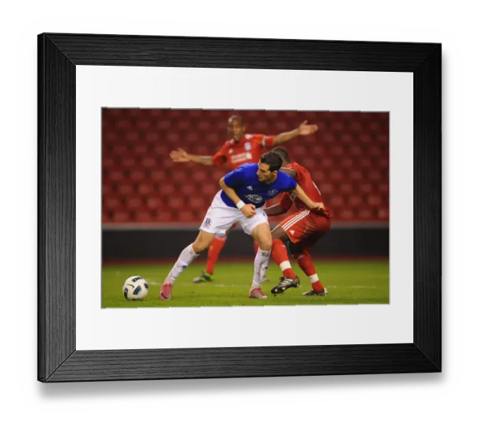 Framed Print : Clash at Anfield: Thomas vs. Vellios - Intense Rivalry in the Reserve League