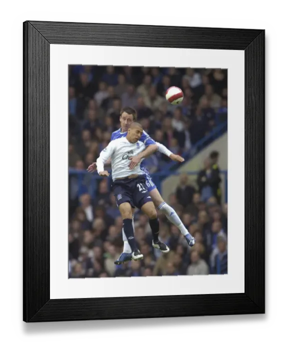 Framed Print : Chelsea v Everton - John Terry and James Vaughan battle for the ball Framed Print : Chelsea v Everton - John Terry and James Vaughan battle for the ball