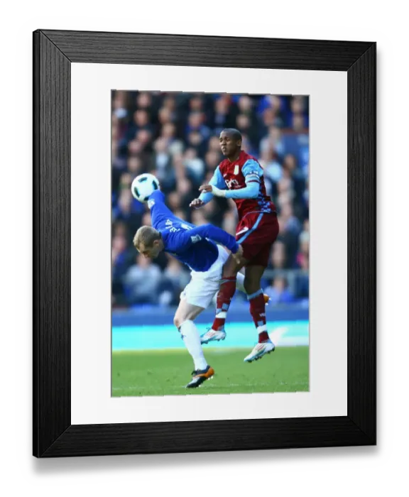 Framed Print : Battle for the Ball: Hibbert vs. Young at Goodison Park - Everton vs. Aston Villa, Premier League (2011)