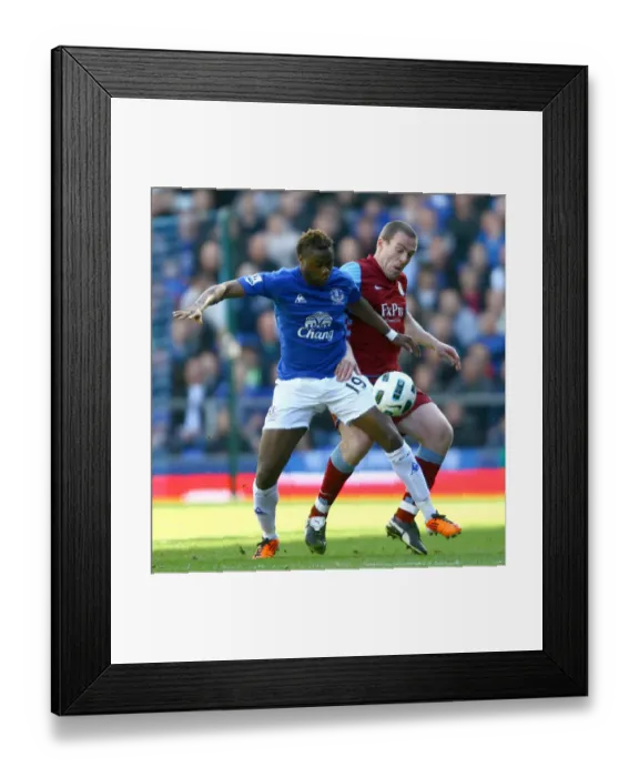Framed Print : Battle for the Ball: Gueye vs. Dunne - Everton vs. Aston Villa Rivalry in the Premier League (04 April 2011) Framed Print : Battle for the Ball: Gueye vs. Dunne - Everton vs. Aston Villa Rivalry in the Premier League (04 April 2011)