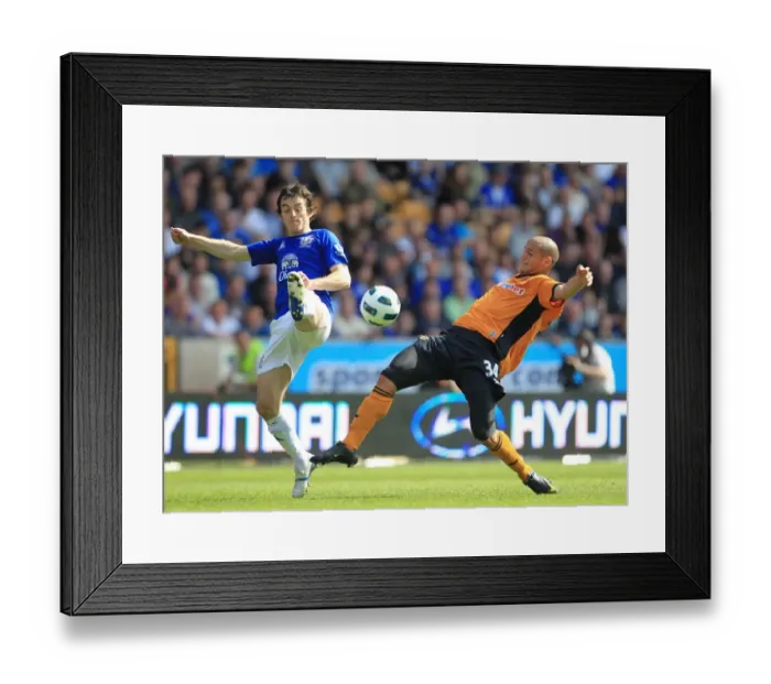 Framed Print : Intense Rivalry: Leighton Baines vs. Adlene Guedioura Battle at Molineux - Barclays Premier League (09 April 2011) Framed Print : Intense Rivalry: Leighton Baines vs. Adlene Guedioura Battle at Molineux - Barclays Premier League (09 April 2011)