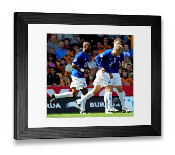 Framed Print : Everton's Double Delight: Neville Scores Brace as Toffees Triumph Over Wolves (09 April 2011)