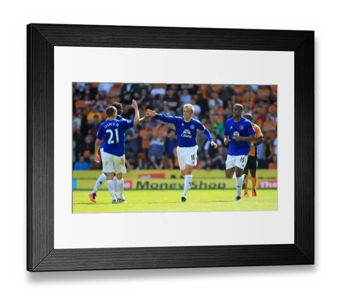 Framed Print : Everton's Phil Neville Scores and Celebrates with Team-mates in Barclays Premier League Victory over Wolverhampton Wanderers (09 April 2011) Framed Print : Everton's Phil Neville Scores and Celebrates with Team-mates in Barclays Premier League Victory over Wolverhampton Wanderers (09 April 2011)