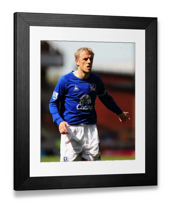 Framed Print : Phil Neville Leads Everton's Charge Against Wolverhampton Wanderers in the Barclays Premier League (09 April 2011) Framed Print : Phil Neville Leads Everton's Charge Against Wolverhampton Wanderers in the Barclays Premier League (09 April 2011)