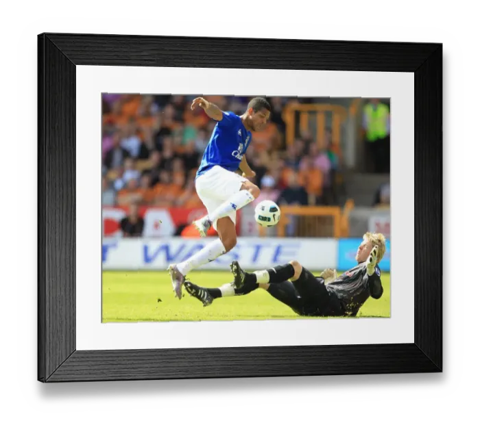 Framed Print : Clash at Molineux: Jermaine Beckford vs. Wayne Hennessey - Everton vs. Wolverhampton Wanderers, Premier League (09 April 2011) Framed Print : Clash at Molineux: Jermaine Beckford vs. Wayne Hennessey - Everton vs. Wolverhampton Wanderers, Premier League (09 April 2011)