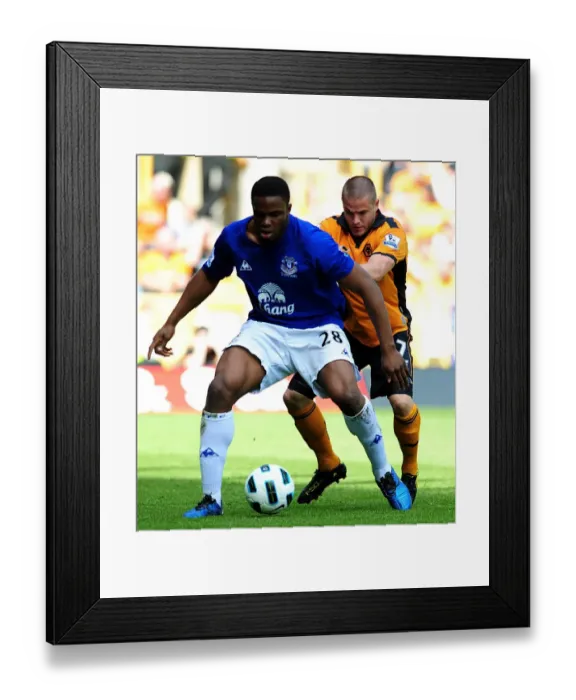 Framed Print : Battle for the Ball: Kightly vs Anichebe - Everton vs Wolverhampton Wanderers in the Premier League (09 April 2011) Framed Print : Battle for the Ball: Kightly vs Anichebe - Everton vs Wolverhampton Wanderers in the Premier League (09 April 2011)