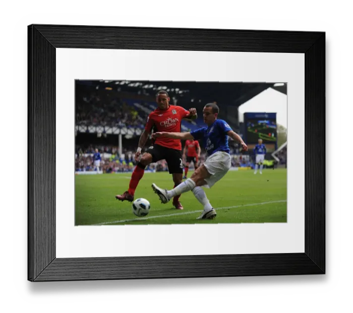 Framed Print : Intense Rivalry: Osman vs. Jones - A Battle for Ball Possession, Everton vs. Blackburn Rovers, Barclays Premier League (16 April 2011, Goodison Park) Framed Print : Intense Rivalry: Osman vs. Jones - A Battle for Ball Possession, Everton vs. Blackburn Rovers, Barclays Premier League (16 April 2011, Goodison Park)