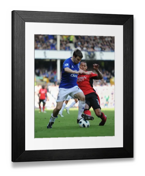 Framed Print : Intense Rivalry: Seamus Coleman vs. Jermaine Jones - A Battle for Ball Possession, Everton vs. Blackburn Rovers (16 April 2011, Goodison Park)