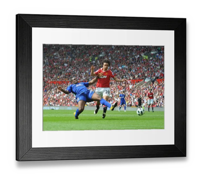 Framed Print : Clash at Old Trafford: Anichebe vs Fabio - A Goal-line Battle in the Premier League Showdown (23 April 2011)
