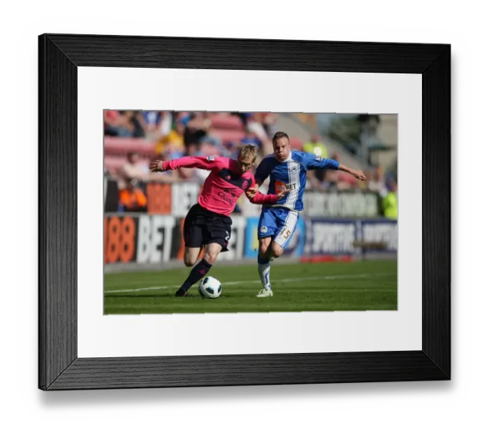 Framed Print : Battle for the Ball: Hibbert vs. Cleverley - Everton vs. Wigan Athletic in Premier League Clash Framed Print : Battle for the Ball: Hibbert vs. Cleverley - Everton vs. Wigan Athletic in Premier League Clash