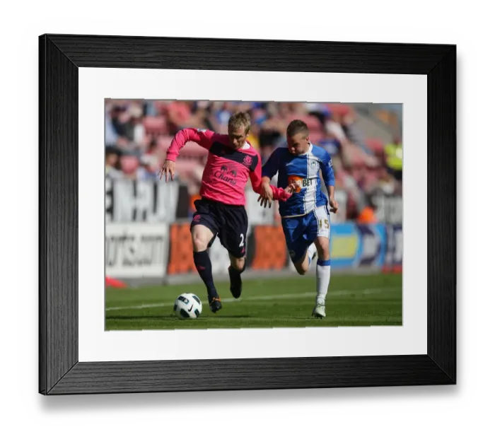 Framed Print : Battle for the Ball: Hibbert vs. Cleverley - Premier League Rivalry (April 2011)