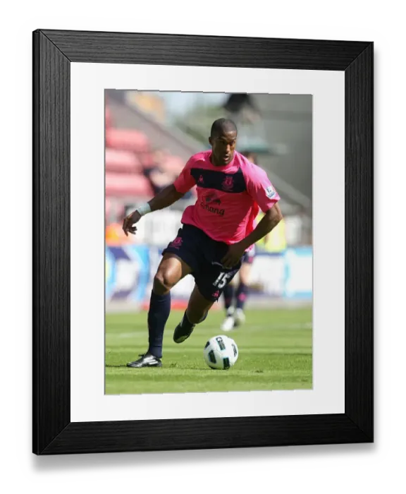 Framed Print : Distin's Unyielding Spirit: Everton's Battle Against Wigan Athletic (30 April 2011) Framed Print : Distin's Unyielding Spirit: Everton's Battle Against Wigan Athletic (30 April 2011)