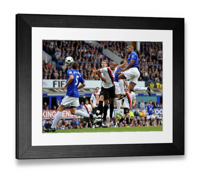 Framed Print : Distin Strikes First: Everton's Winning Goal vs Manchester City (07 May 2011, Goodison Park) Framed Print : Distin Strikes First: Everton's Winning Goal vs Manchester City (07 May 2011, Goodison Park)