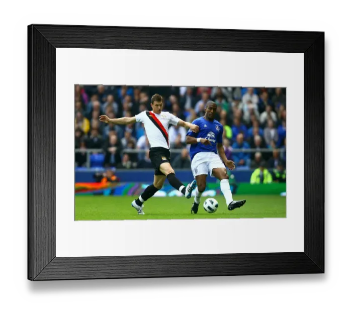 Framed Print : Distin vs Dzeko: Everton vs Manchester City Clash at Goodison Park (07 May 2011) Framed Print : Distin vs Dzeko: Everton vs Manchester City Clash at Goodison Park (07 May 2011)