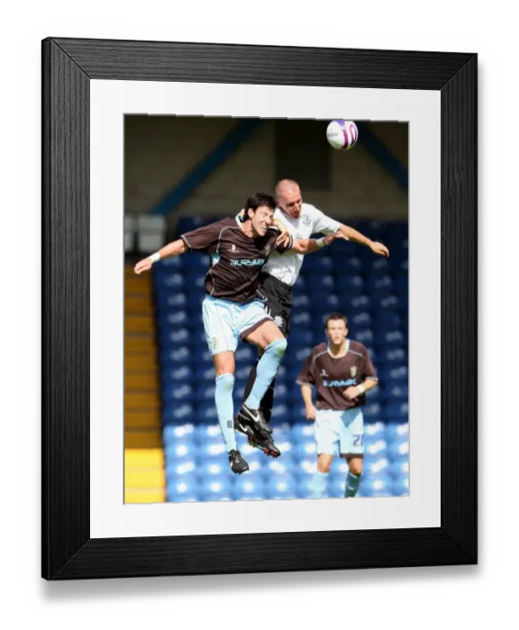 Framed Print : Stubbs vs Broughton: A Heading Showdown in the 2007 Everton-Bury Pre-Season Friendly