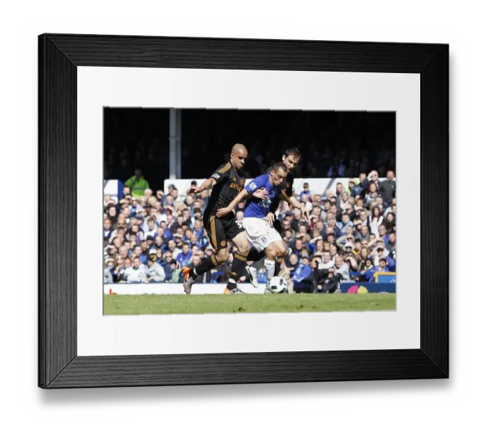 Framed Print : Leon Osman's Defiant Stand: Everton vs. Chelsea's Alex and Ivanovic in Intense Barclays Premier League Showdown (May 2011) Framed Print : Leon Osman's Defiant Stand: Everton vs. Chelsea's Alex and Ivanovic in Intense Barclays Premier League Showdown (May 2011)