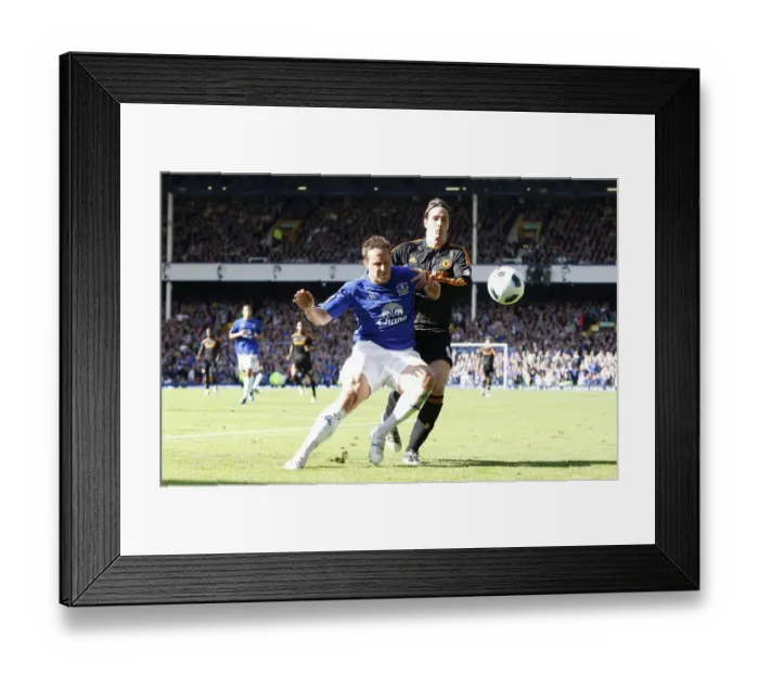 Framed Print : Jagielka vs. Torres: A Premier League Battle at Goodison Park (Everton vs. Chelsea, May 2011) Framed Print : Jagielka vs. Torres: A Premier League Battle at Goodison Park (Everton vs. Chelsea, May 2011)