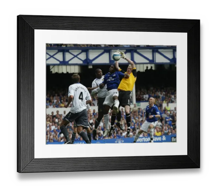 Framed Print : Everton vs Wigan Athletic: Anichebe vs Kirkland - A Premier League Battle at Goodison Park (August 11, 2007)