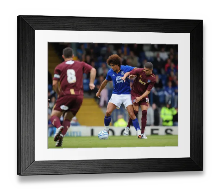 Framed Print : Fellaini vs. Lowe: A Football Battle at Gigg Lane (July 15, 2011) Framed Print : Fellaini vs. Lowe: A Football Battle at Gigg Lane (July 15, 2011)