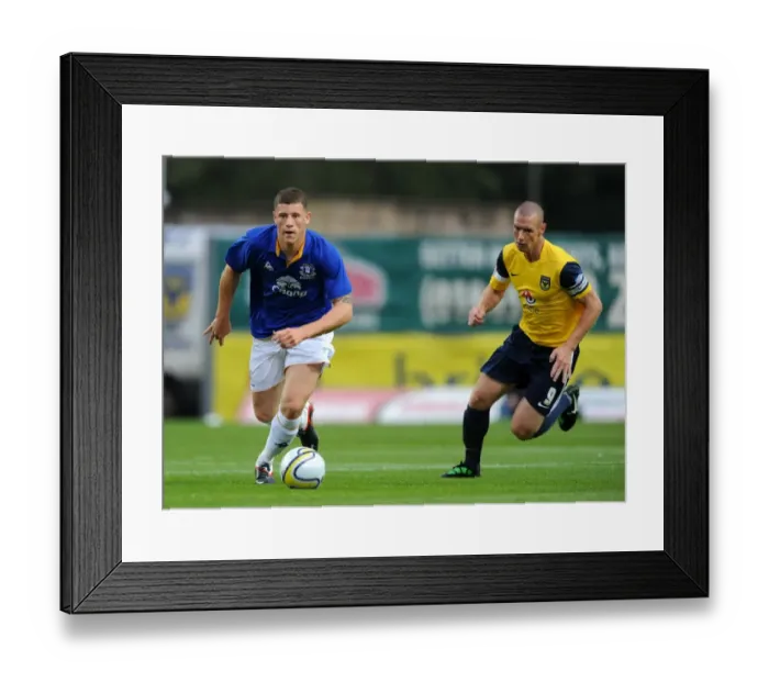 Framed Print : Ross Barkley vs James Constable: A Pre-Season Battle at Kassam Stadium (2011)