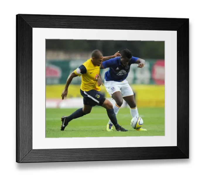 Framed Print : Battle for the Ball: Magaye Gueye vs Damian Batt, Oxford United vs Everton (2011) Framed Print : Battle for the Ball: Magaye Gueye vs Damian Batt, Oxford United vs Everton (2011)