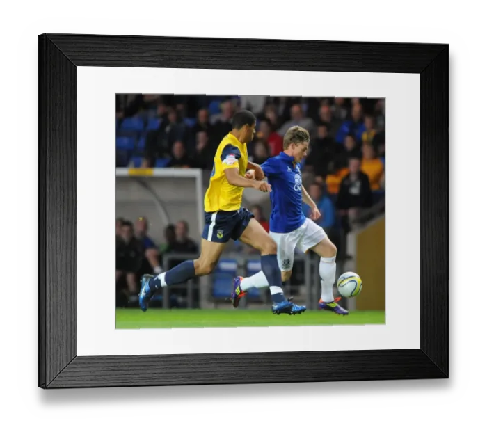 Framed Print : Battle for the Ball: McAleny vs. James - Oxford United vs. Everton (2011) Framed Print : Battle for the Ball: McAleny vs. James - Oxford United vs. Everton (2011)