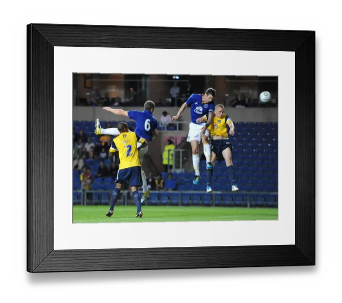 Framed Print : Shane Duffy's Determined Header: Everton's Pre-Season Showdown at Oxford United (2011) Framed Print : Shane Duffy's Determined Header: Everton's Pre-Season Showdown at Oxford United (2011)