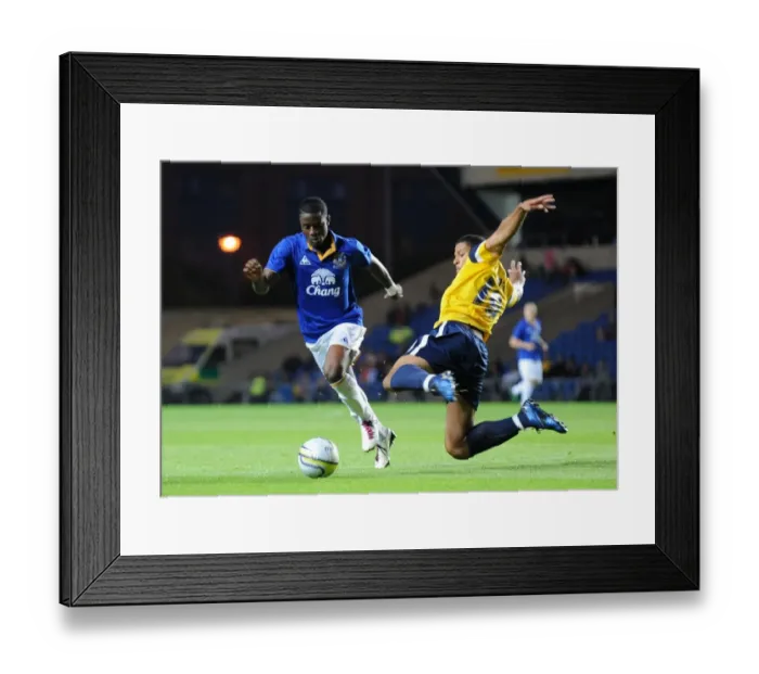 Framed Print : Battle for the Ball: Femi Oregbiru of Everton and Ryan James of Oxford United Clash in Pre-Season Friendly (2011) Framed Print : Battle for the Ball: Femi Oregbiru of Everton and Ryan James of Oxford United Clash in Pre-Season Friendly (2011)
