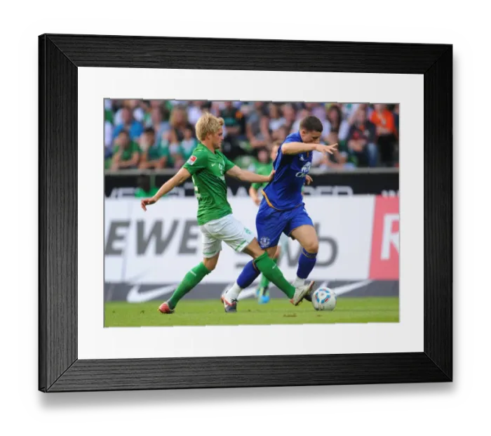 Framed Print : Florian Trinks vs. Ross Barkley: A Clash of Talents - Werder Bremen vs. Everton (2011) Framed Print : Florian Trinks vs. Ross Barkley: A Clash of Talents - Werder Bremen vs. Everton (2011)