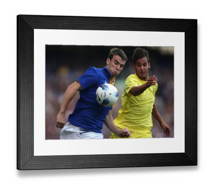 Framed Print : Seamus Coleman vs. Joan Oriol: A Clash of Wings at Goodison Park (2011) - Everton vs. Villarreal Pre-Season Encounter Framed Print : Seamus Coleman vs. Joan Oriol: A Clash of Wings at Goodison Park (2011) - Everton vs. Villarreal Pre-Season Encounter