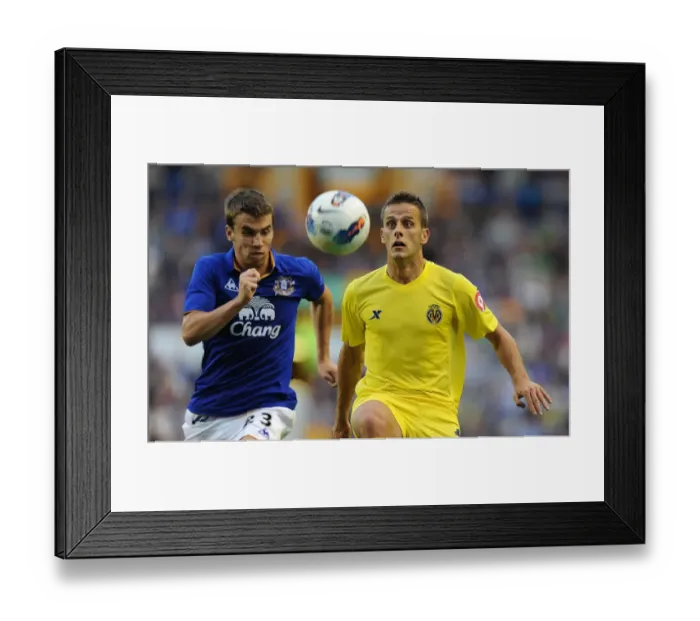 Framed Print : Seamus Coleman vs. Javier Camunas: A Battle at Goodison Park - Everton vs. Villarreal (August 2011)