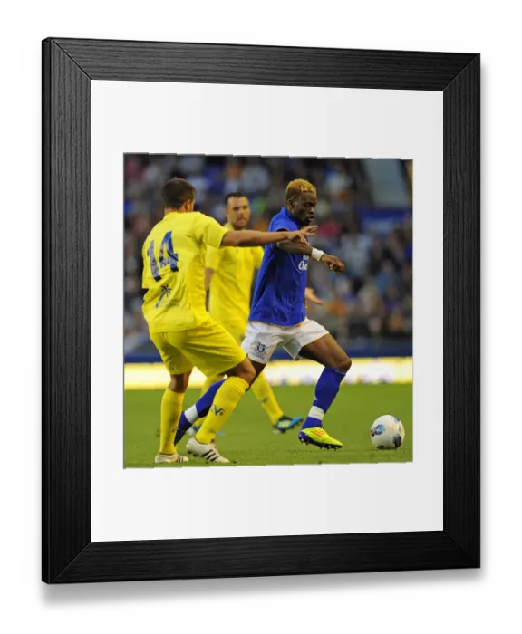 Framed Print : Everton's Louis Saha Battles Past Villarreal's Mario in Thrilling Pre-Season Clash at Goodison Park (05 August 2011) Framed Print : Everton's Louis Saha Battles Past Villarreal's Mario in Thrilling Pre-Season Clash at Goodison Park (05 August 2011)