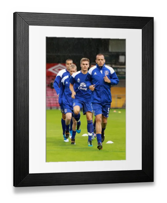 Framed Print : Everton FC: John Heitinga Kicks Off Warm-Up Before Bohemians Friendly (15 August 2011) Framed Print : Everton FC: John Heitinga Kicks Off Warm-Up Before Bohemians Friendly (15 August 2011)