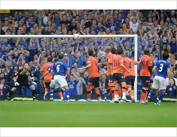 Everton's Leighton Baines Stuns with a Free-Kick Hit off the Bar vs. Queens Park Rangers (2011, Barclays Premier League)