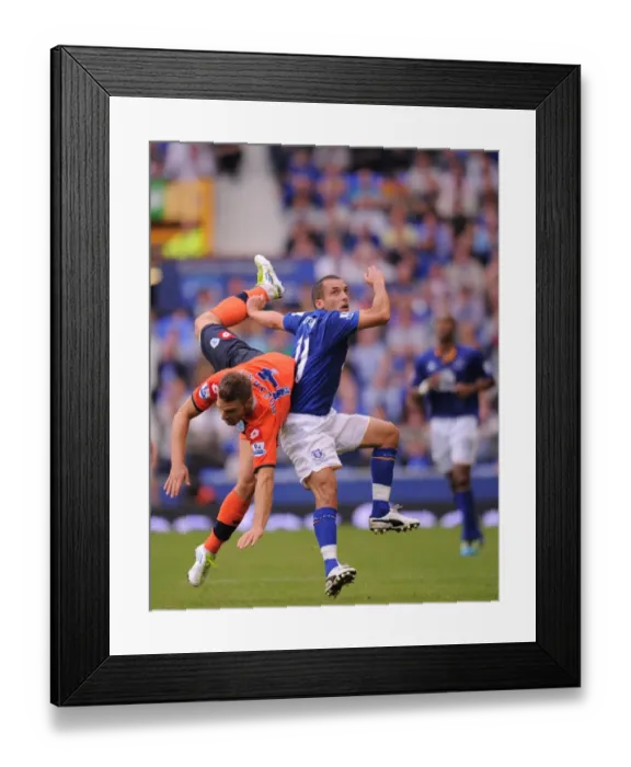 Framed Print : Osman vs. Buzsaky: A Battle at Goodison Park - Everton vs. Queens Park Rangers, Barclays Premier League (2011) Framed Print : Osman vs. Buzsaky: A Battle at Goodison Park - Everton vs. Queens Park Rangers, Barclays Premier League (2011)
