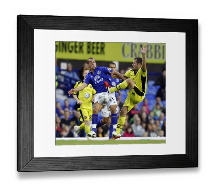 Framed Print : Leon Osman vs Matthew Lowton: Everton vs Sheffield United - Carling Cup Second Round Battle at Goodison Park