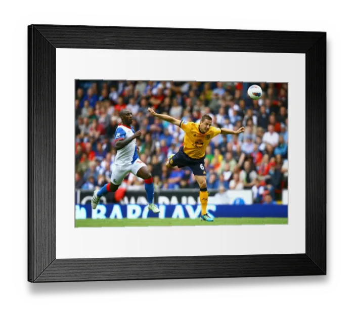 Framed Print : Jagielka Scores the Winner: Everton's Phil Jagielka Heads Past Roberts in the Barclays Premier League Clash at Ewood Park (August 2011) Framed Print : Jagielka Scores the Winner: Everton's Phil Jagielka Heads Past Roberts in the Barclays Premier League Clash at Ewood Park (August 2011)