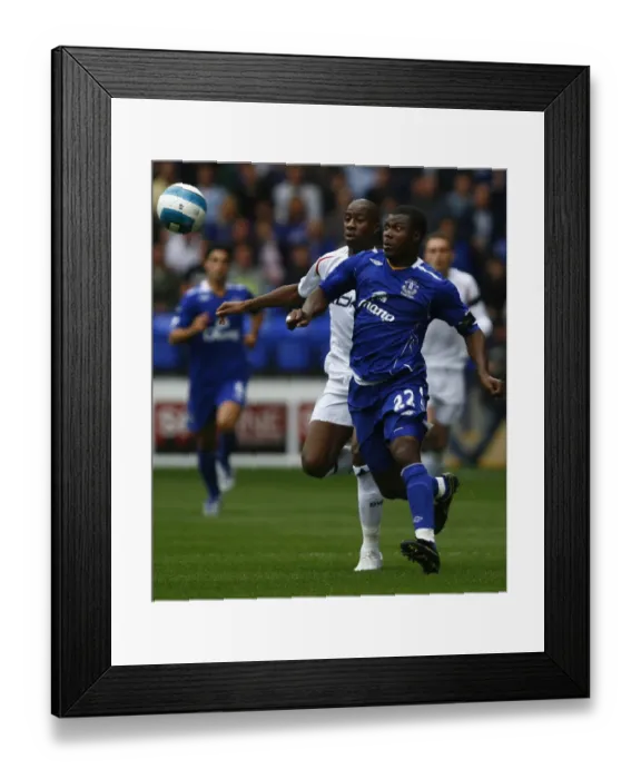 Framed Print : Intense Rivalry: Meite vs Yakubu Battle at The Reebok Stadium (01 / 09 / 07) Framed Print : Intense Rivalry: Meite vs Yakubu Battle at The Reebok Stadium (01 / 09 / 07)