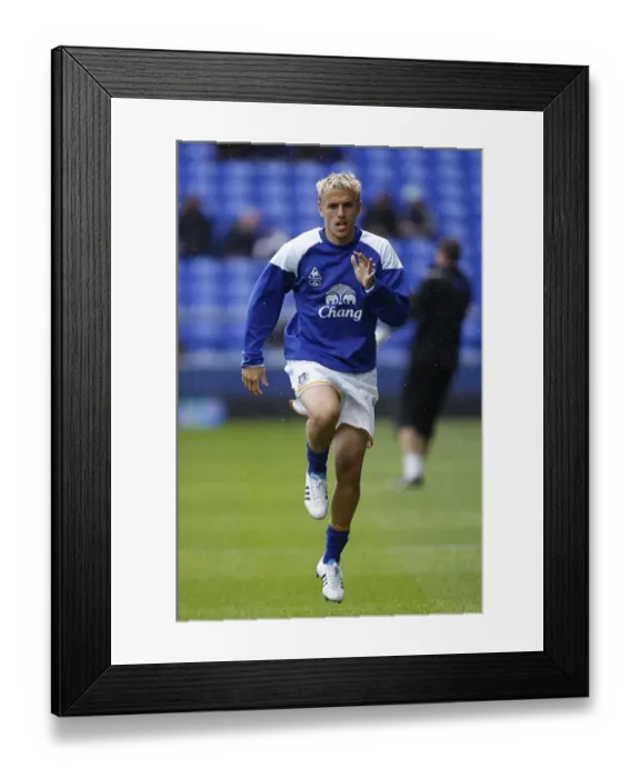 Framed Print : Phil Neville Leads Everton at Goodison Park Against Wigan Athletic, Barclays Premier League (September 17, 2011) Framed Print : Phil Neville Leads Everton at Goodison Park Against Wigan Athletic, Barclays Premier League (September 17, 2011)