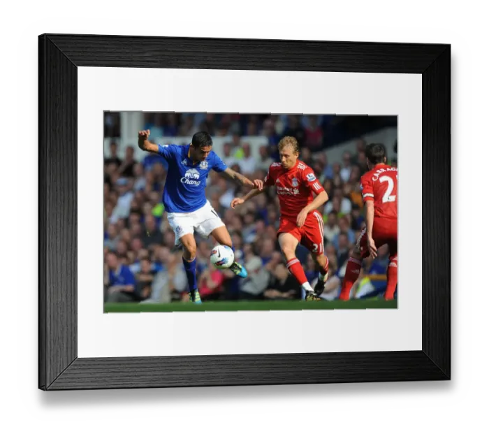 Framed Print : Clash at Goodison Park: Leiva vs. Cahill - Everton vs. Liverpool, Barclays Premier League (2011) - Intense Rivalry on the Field Framed Print : Clash at Goodison Park: Leiva vs. Cahill - Everton vs. Liverpool, Barclays Premier League (2011) - Intense Rivalry on the Field