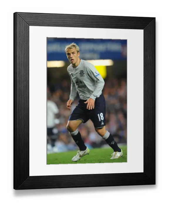 Framed Print : Phil Neville's Battle at Stamford Bridge: Everton Star Clashes with Chelsea in the Premier League (15 October 2011)