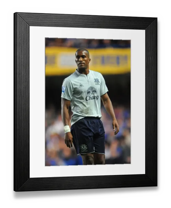 Framed Print : Defiant Distin Stands Firm Against Chelsea: Everton's Unyielding Rivalry (15 October 2011, Barclays Premier League)