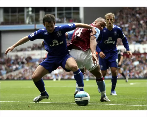 Agbonlahor vs. Baines: Intense Action from Aston Villa vs. Everton (2007) Football Match
