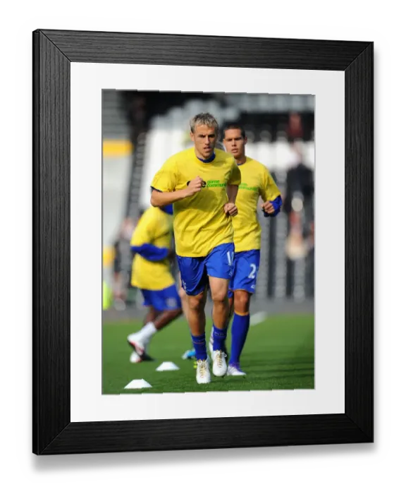 Framed Print : Phil Neville Leads Everton at Craven Cottage: Barclays Premier League Match against Fulham (23 October 2011)